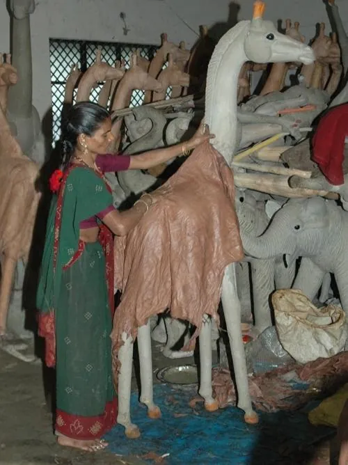 Leather Pasting: a step in handcrafting a leather animal sculpture